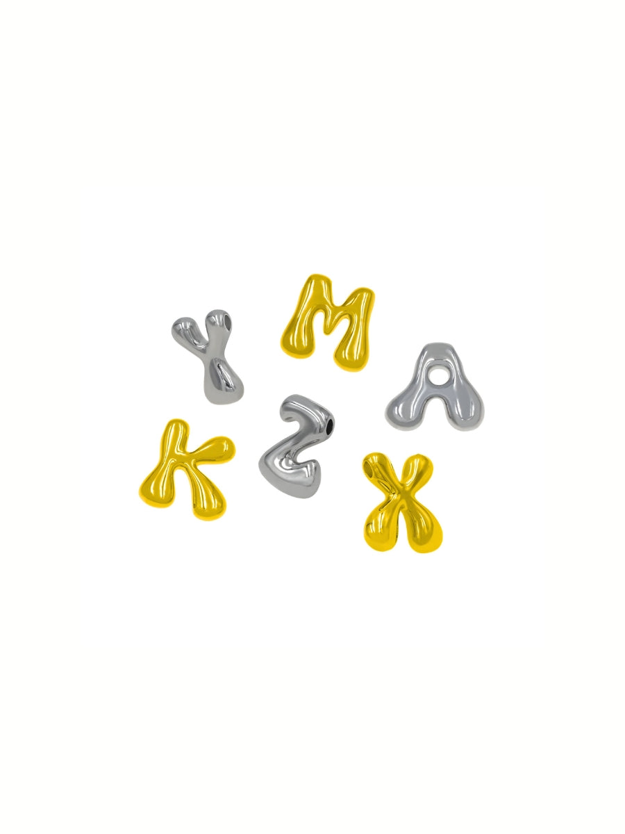 Gold and silver letter options for the custom bag charm on a white background