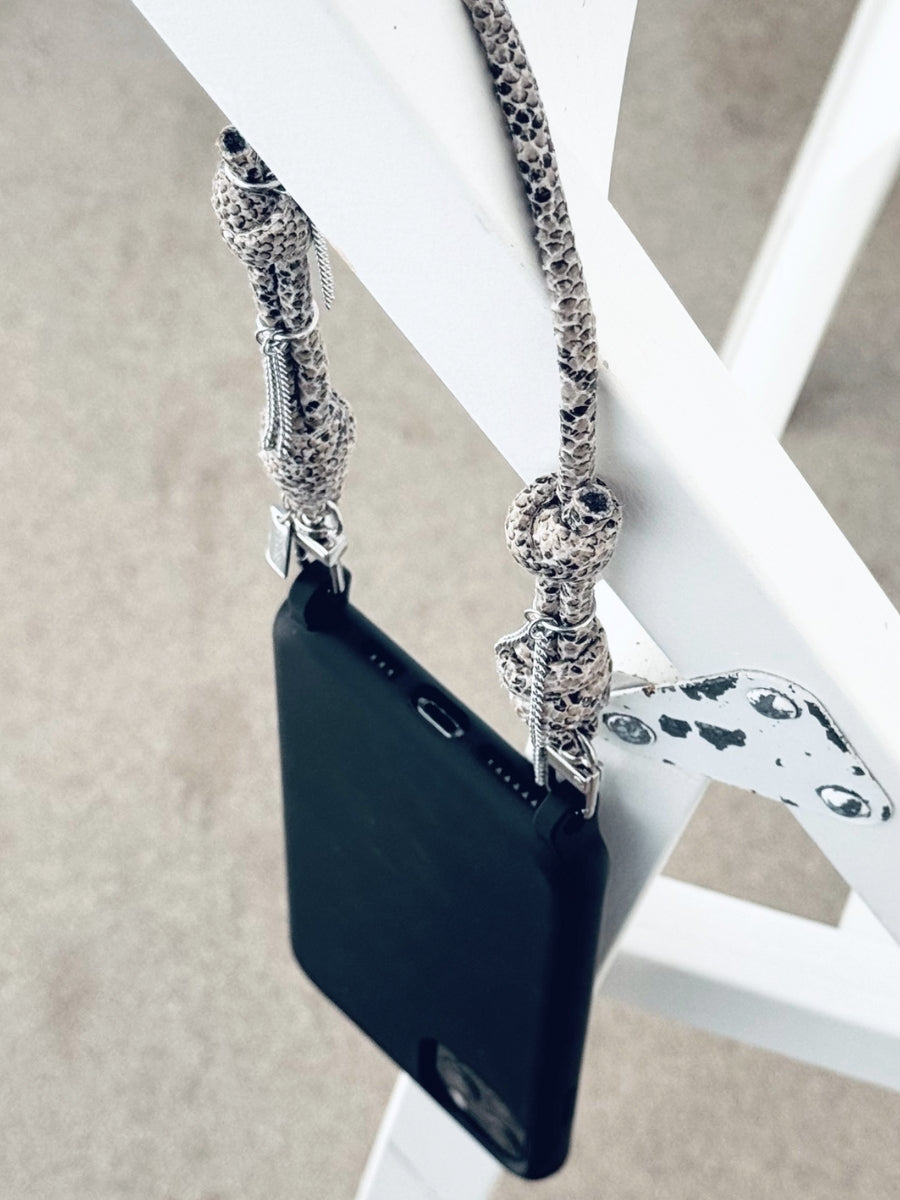 Wild Ritual multi-use phone strap with fringe chain details