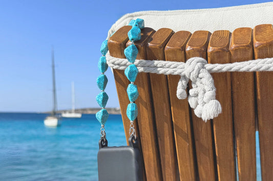 Coastal summer accessories styled by the sea featuring a turquoise phone strap by SPECSET