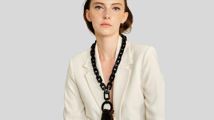 Bold black chunky eyewear lanyard by SPECSET, worn on a model as glasses chain making a statement.