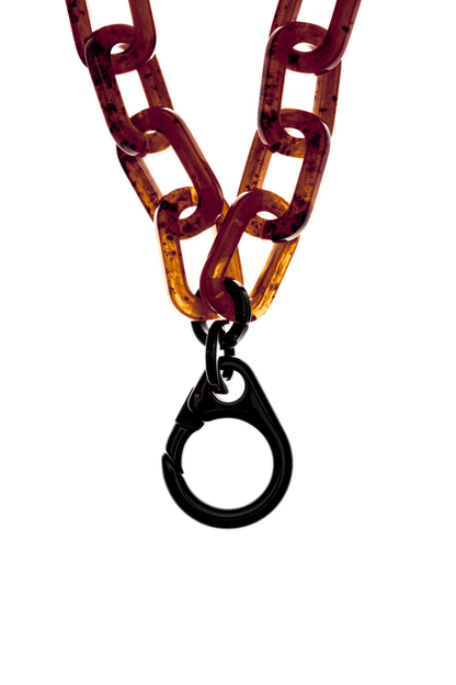 SPECSET BOLDLY Phone Chain close-up, featuring the chunky tortoise-shell acetate chain and the secure black acrylic clasp.