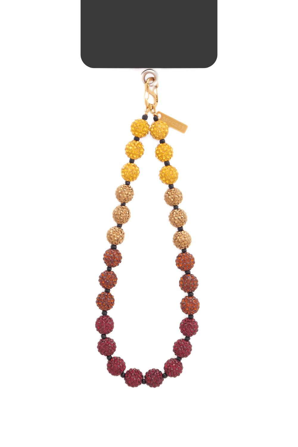 Ombre beaded phone strap hanging from a device.