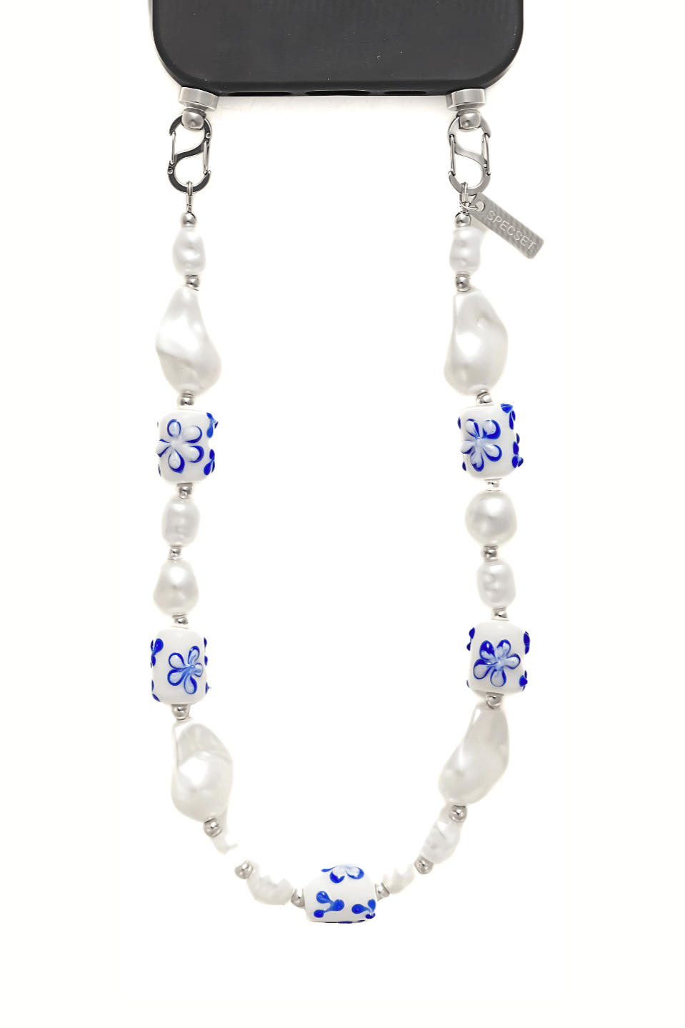 Close-up of the Greek Chic Phone Strap featuring white pearls and blue floral ceramic beads, attached to a phone case with metal clasps.