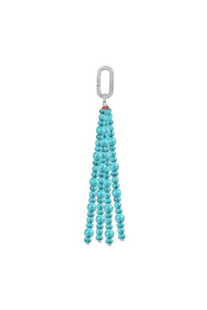Close-up studio shot of a long tassel bag charm made of bright turquoise Howlite gemstone beads. The tassel hangs from a sparkly silver carabiner clasp with a small orange-red bead detail. 