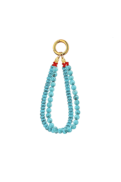 Turquoise beaded necklace with gold clasp on a white background