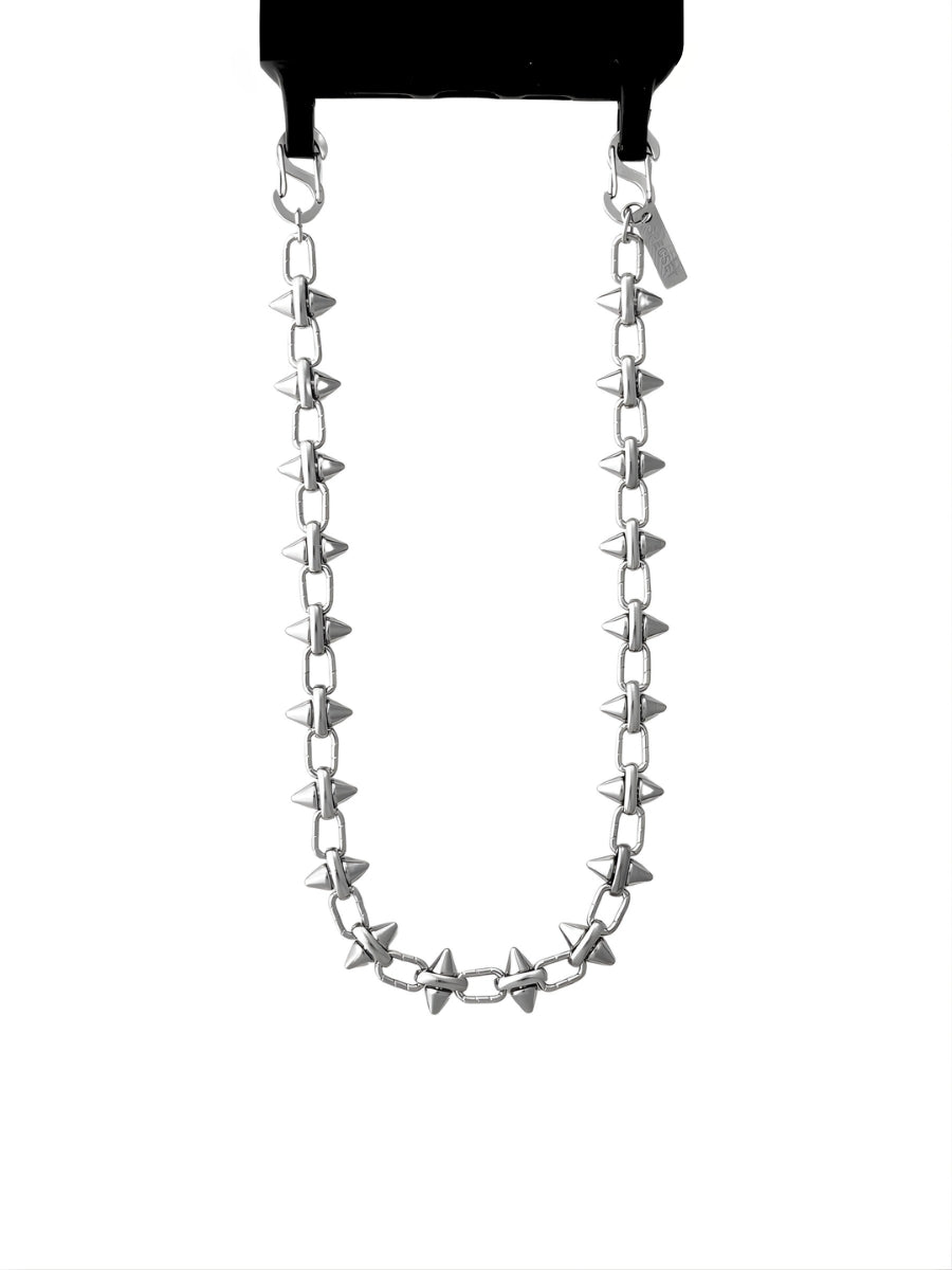 Silver phone chain with spike-like attachments on a white background.