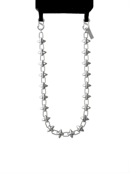 Silver phone chain with spike-like attachments on a white background.