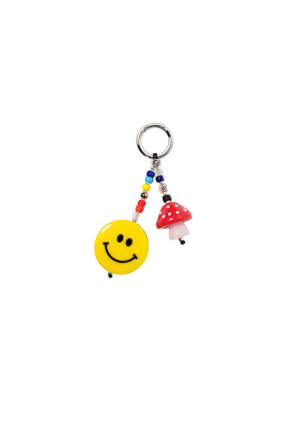 Keychain with smiley face charm and mushroom on a white background