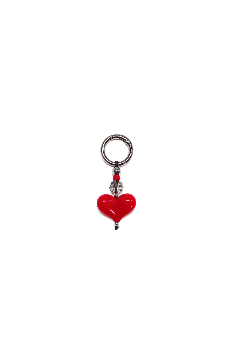 Red heart-shaped charm with a silver ring on a white background