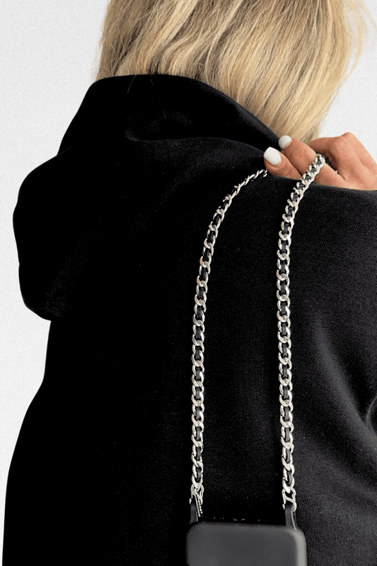 Iconic Silver Phone Chain worn over the shoulder.