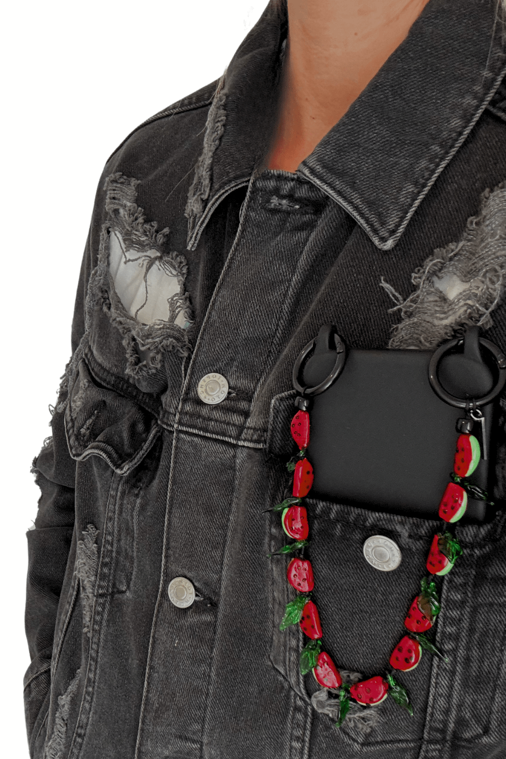 Juicy Crush strap attached to a black phone case.