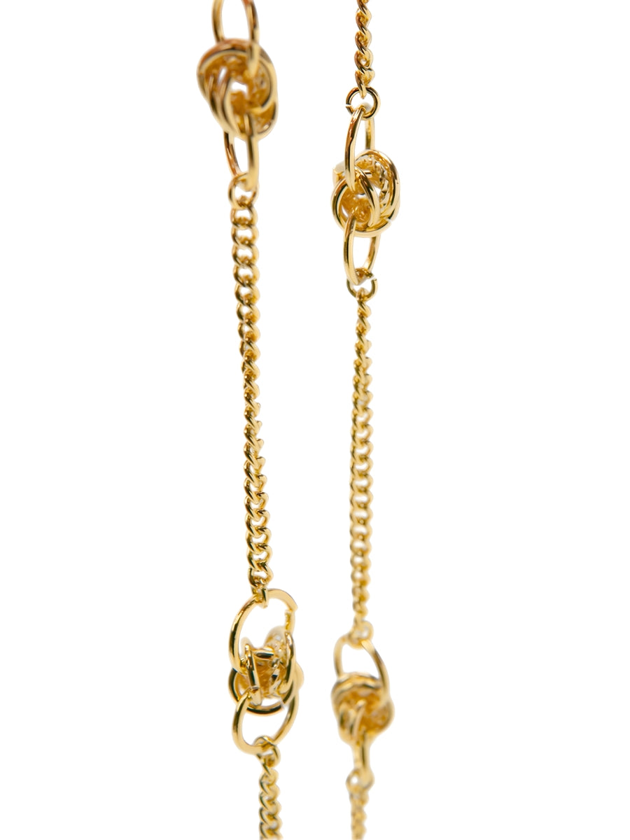 Gold eyewear chain with mixed-size round details from surgical stainless on white background.