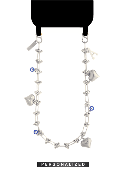 SPECSET Lover's Link personalized phone chain in silver, featuring chunky Heart charms, Evil Eye details, and a custom initial.