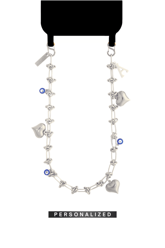 SPECSET Lover's Link personalized phone chain in silver, featuring chunky Heart charms, Evil Eye details, and a custom initial.