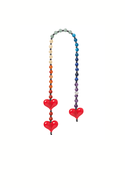 Lovlie rainbow gemstone bag charm featuring red heart beads on a white background.
