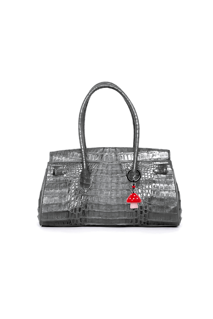 Gray textured handbag with a red and white tag on a white background