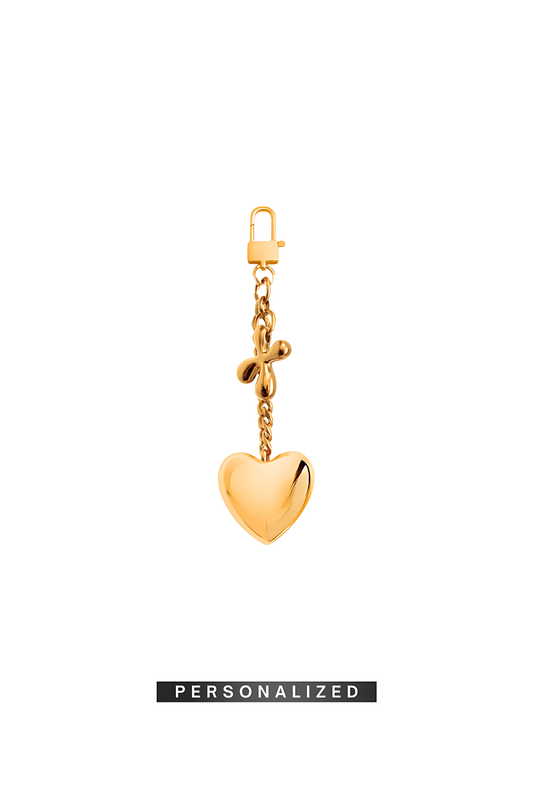 Marked Soul gold heart bag charm with personalized initial.