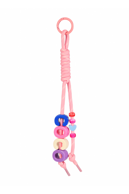 Pink bag charm keychain with colorful beads on a white background.