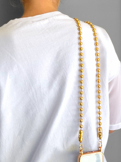 Back view showing the gold Play Call ball chain hanging comfortably across the back.