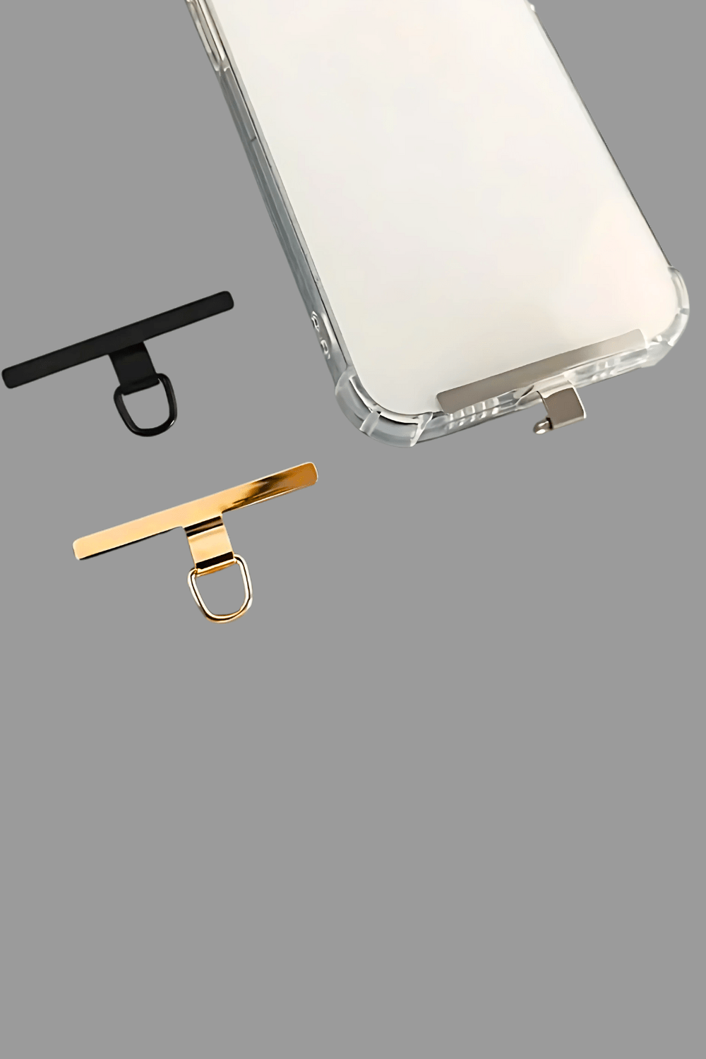 Set of three clips in white, gold, and black on a gray background