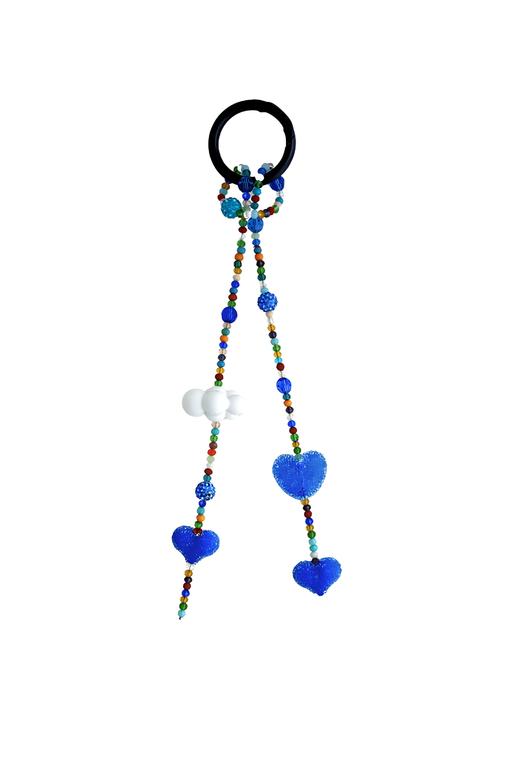 Close-up of candy cloud and colorful beads on heart keychain.