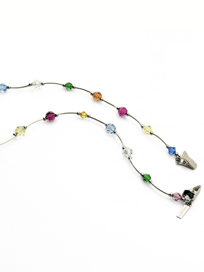 Overview of the SOCIALITE eyewear strap featuring a series of colorful faceted crystals in blue, green, orange, yellow, pink, and clear.