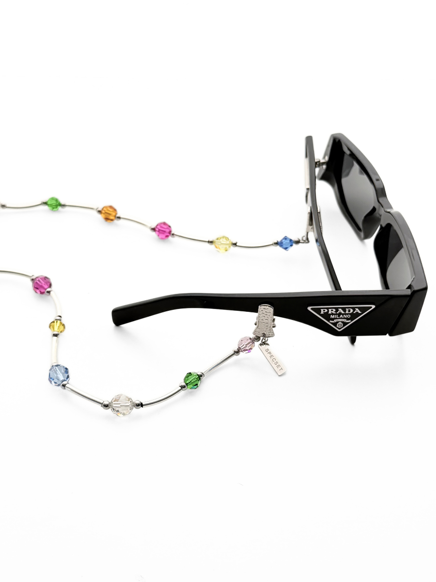 Black Prada sunglasses with silver bar links, colorful faceted Swarovski crystals, set against a white background.